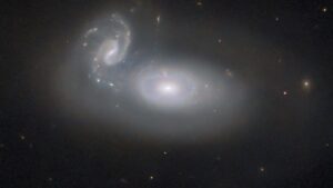 Hubble Telescope Captures Image of Merging Galaxies in Coma Cluster, 390 Million Light-Years Away