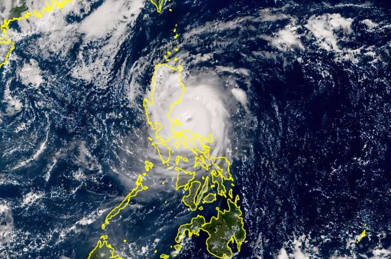 A Himawari satellite handout photo from the Japan Meteorological Agency website shows Super Typhoon Man-yi making landfall on the island of Luzon in the Philippines