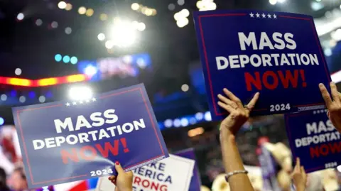 Getty Images 'Mass Deportation' signs at the RNC. 