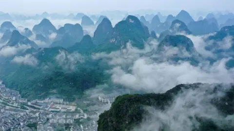 Getty Images The karst landscape is being seen after rain in Yangshuo, South China's Guangxi Zhuang Autonomous Region, on April 24, 2024. 