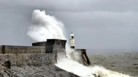 Nadezna / BBC Weather Watchers Waves hitting the sea wall at Porthcawl in Bridgend county against a grey sky