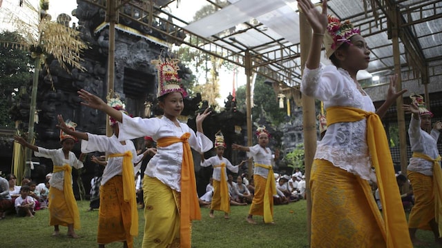 "Being a rejang started when she lost her tooth until pre-puberty. We believe they are still pure to present dance to God during this time," her father Nyoman Subrata says. As traditional chief of Geriana Kauh village, Subrata says he is proud to see his daughter participating in this ritual. Subrata is committed to the responsibilities of maintaining religious traditions that have passed down through generations. (Image: AP Photo)