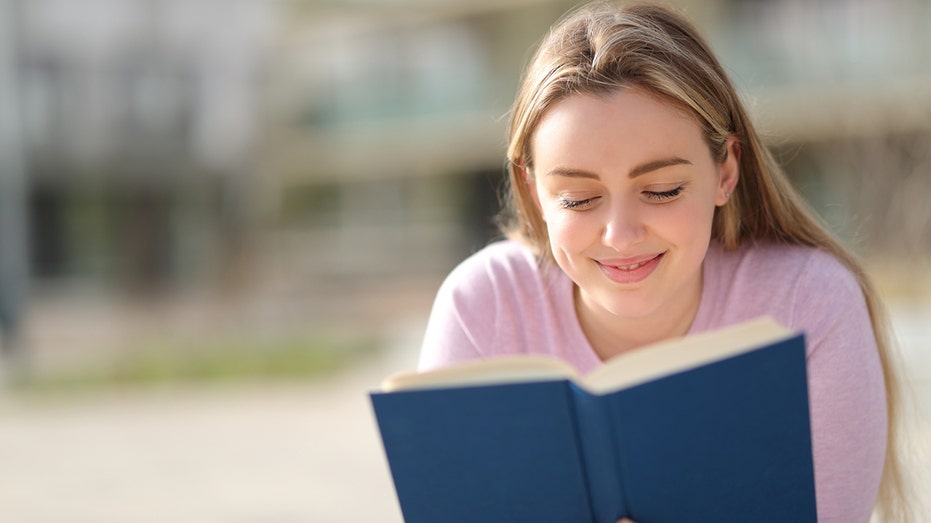 Teen reading a book