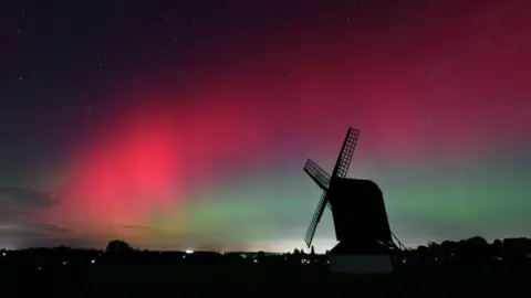 Getty Images PITSTONE, UNITED KINGDOM - OCTOBER 10: The Aurora Borealis lights up the night sky over Pitstone Windmill in Buckinghamshire on October 10, 2024 in Pitstone, United Kingdom. The Aurora Borealis or "Northern Lights" results from geomagnetic storms and can be seen as far south as the UK overnight on the 10th October. (Photo by Jim Dyson/Getty Images)