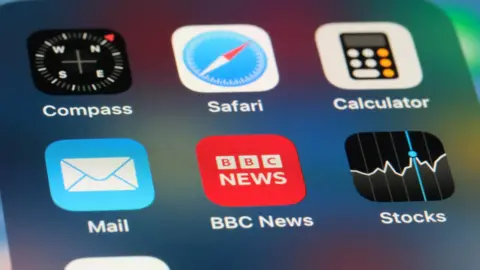 Getty Images Screenshot of an Apple iPhone's menu screen. It displays the icons and names of six apps, including Compass, Safari, Calculator, Mail, BBC News and Stocks