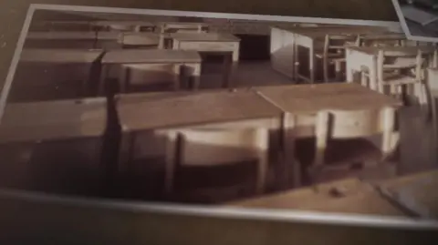 Old pictures of school desks in a classroom