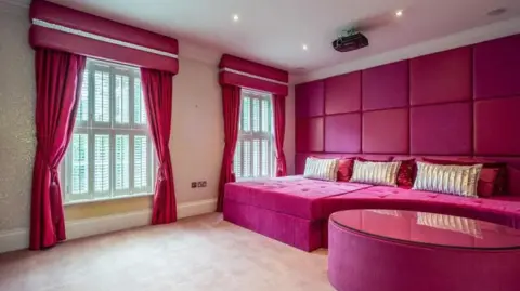 Berkeley Shaw Cinema room at Klopp's mansion with pink decor and viewing sofa