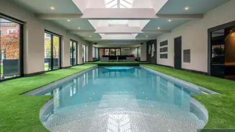 Berkeley Shaw The swimming pool at Klopp's ex home edged with artificial grass