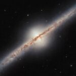 Hubble Space Telescope Captures Rare Edge-On View of a Spiral Galaxy Located Millions of Light-Years Away