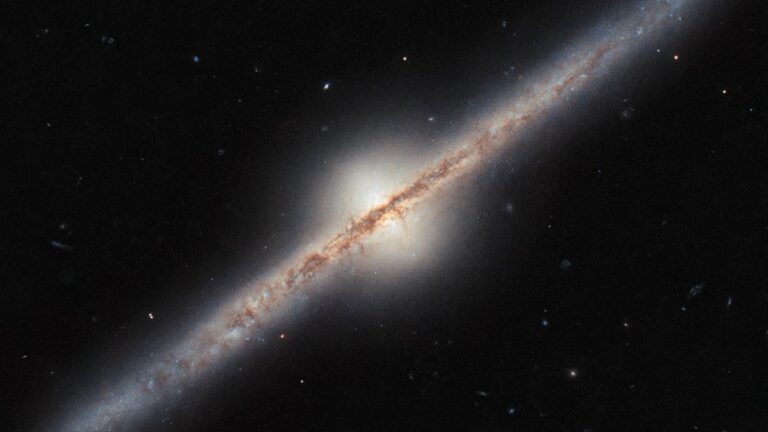 Hubble Space Telescope Captures Rare Edge-On View of a Spiral Galaxy Located Millions of Light-Years Away