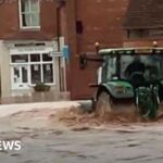 Man arrested after tractor drive through town