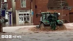 Man arrested after tractor drive through town