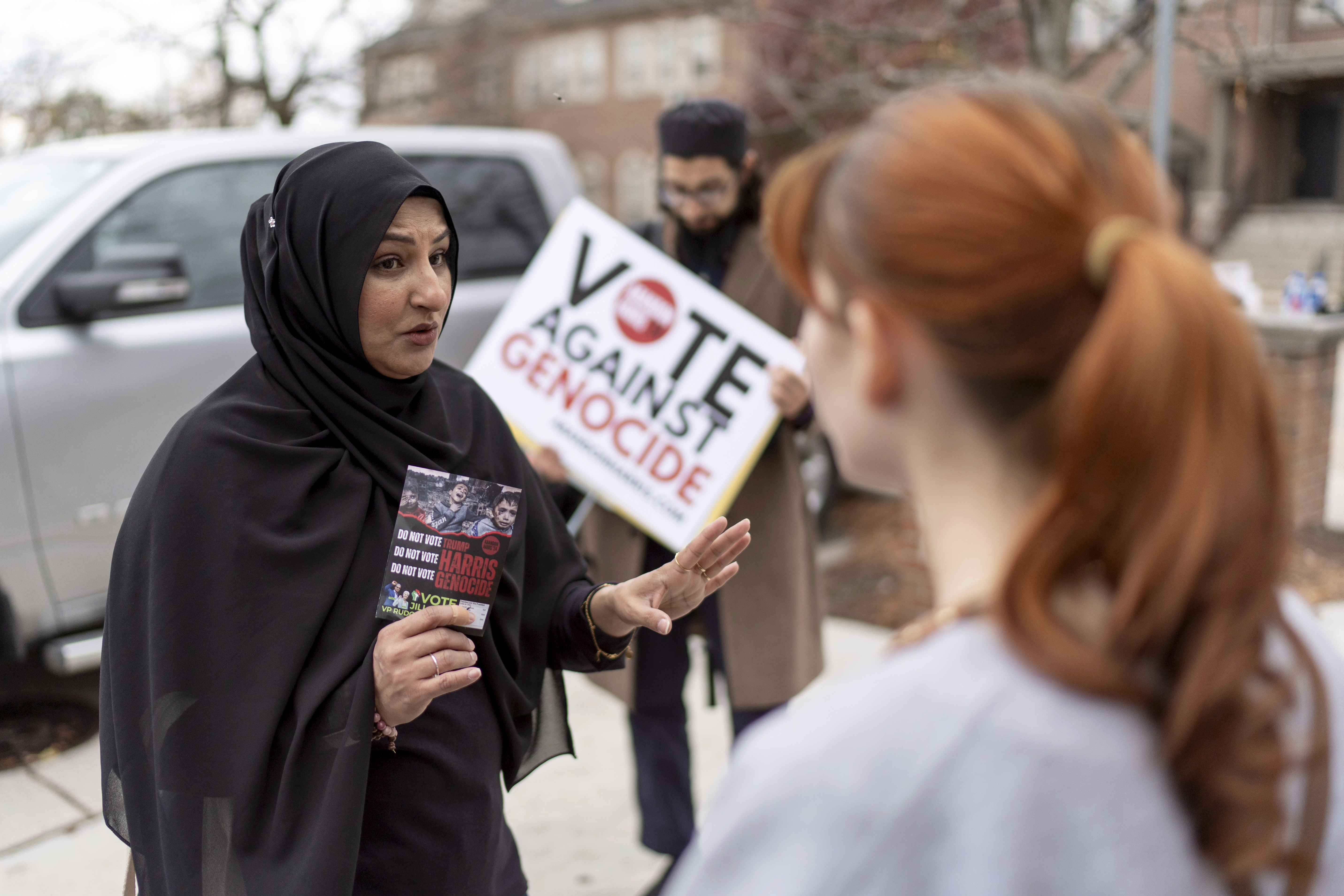 Farah Khan (left), co-chair of the Abandon Harris Michigan campaign, tries to convince Caitlyn Brown to vote for Green Party presidential candidate Jill Stein.