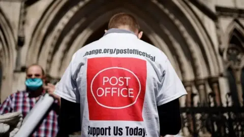 Getty Images A Post Office miscarriages of justice campaigner at the High Court 