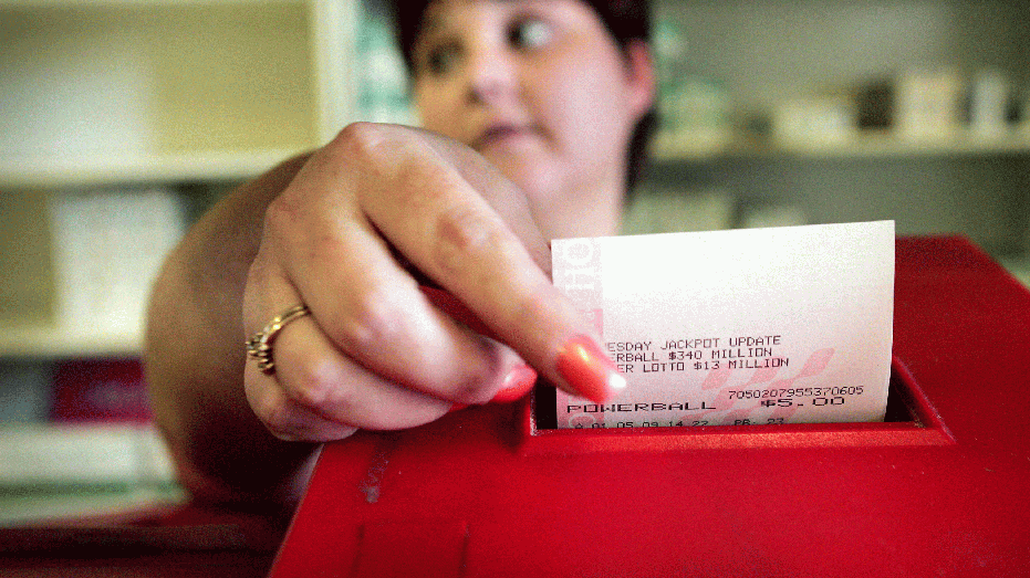 WHITING, IN - OCTOBER 17: Maryanne Rearick rings up Powerball lottery tickets for customers at a cigarette store October 17, 2005 in Whiting, Indiana. The numbers for the multi-state Powerball lottery, which is currently at the highest amount ever $340 million, will be drawn on October 19. (Photo by Scott Olson/Getty Images)