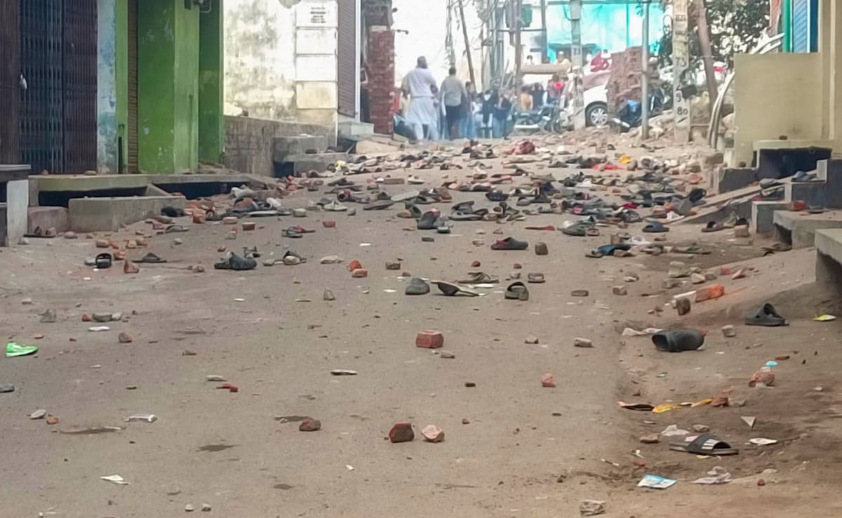 Footwears and brick bats lying on a road after violence erupted in Sambhal