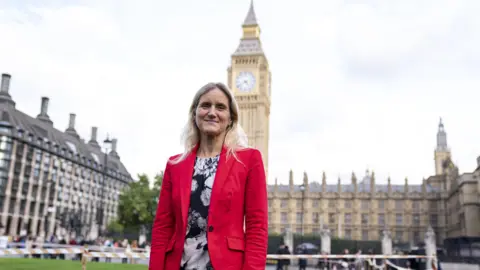 PA Media Labour MP Kim Leadbeater stands in front of the houses of parliament looking ahead of the vote on assisted dying.