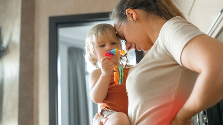 woman holding toddler