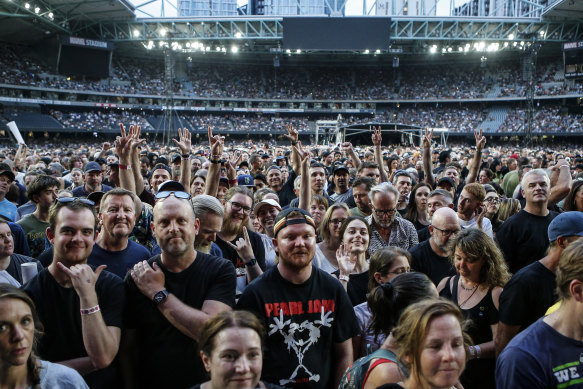 Fans cheer the arrival of Pearl Jam on stage at Marvel Stadium on Saturday night.