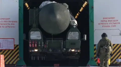 Russian defence ministry A ballistic missile is wheeled out of a warehouse on a nuclear base in Russia