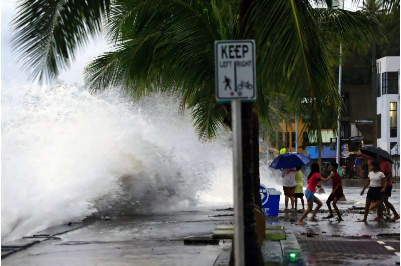 Waves break along a seawall in Legaspi City as Super Typhoon sweeping towards the Philippines