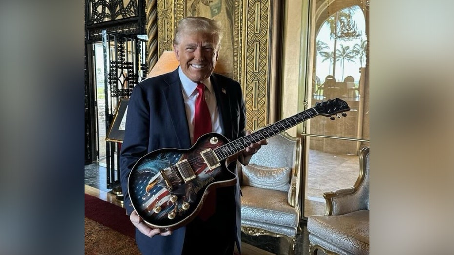 President-elect Trump holding a guitar