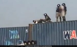 Viral Video Shows Pakistan Forces Pushing Praying Protester Off Containers