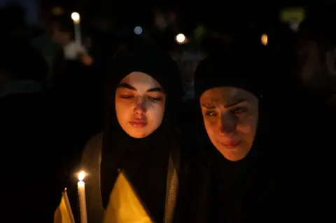 Joel Gunter/BBC People wept and held candles and pictures of Nasrallah, while speeches by the former Hezbollah leader played from a sound system.