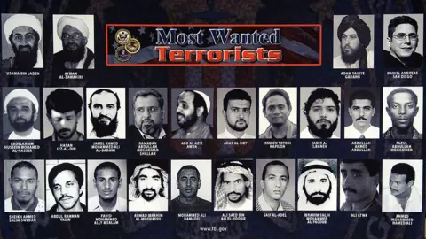 Getty A most wanted poster showing 24 of the most wanted terrorists in the US