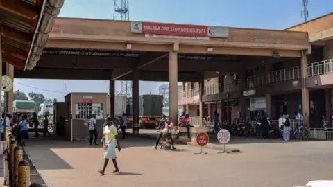 AFP A general view of the Kenyan side of the Malaba border post. A security booth can be seen under an arch, which has a banner that says "Malaba One Stop Border Post".