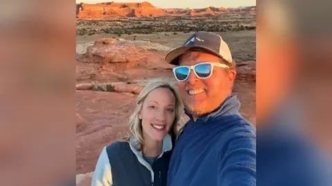 Matthew Parrott Mr Parrott and his partner Beth taking a selfie at  a canyon setting