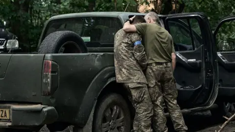 Getty Images A soldier cries after returning from Kursk