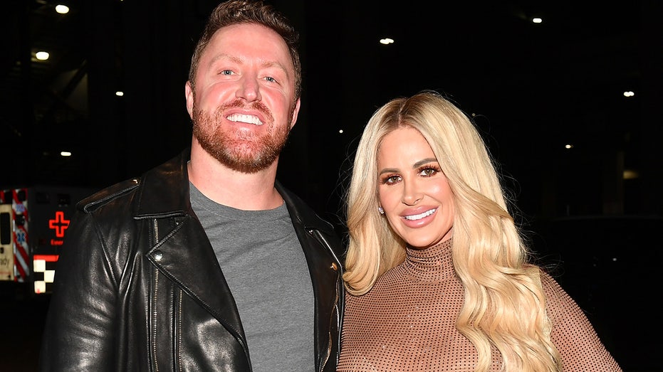 Kim Zolciak wears sparkling bodysuit with Kroy Biermann in a black leather jacket