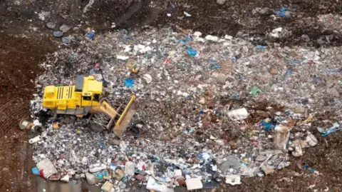 Getty Images Landfill site with yellow JCB