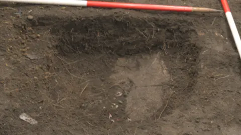 West Midlands Police A shallow grave where the remains were found