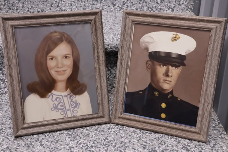 Side-by-side framed photos of a young woman with a '60s haircut, and a young man in a military uniform. 