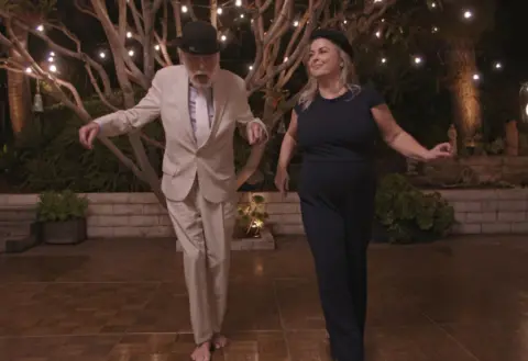 Parlophone Records Dick Van Dyke dances barefoot with his wife Arlene Silver, while both wear bowler hats