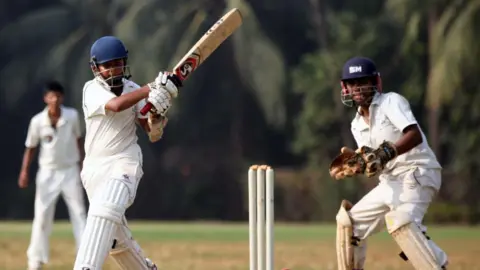 Getty Images MUMBAI, INDIA - NOVEMBER 8, 2011: Rizvi Springfield's Prithvi Shaw hits the ball in a Harris Shield Match against Anjuman. (Photo by Kunal Patil/Hindustan Times via Getty Images)