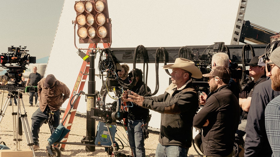 Taylor Sheridan directing a scene from "Landman"