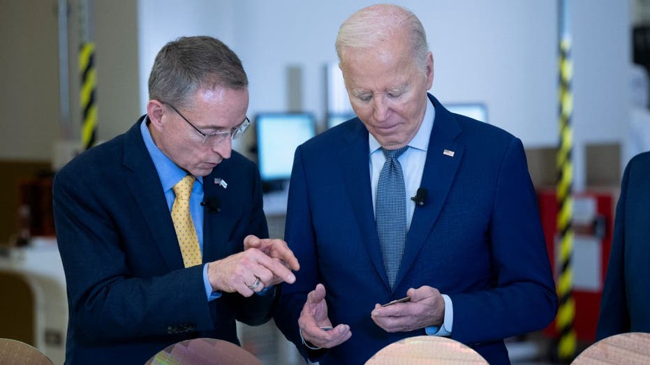 former Intel CEO Pat Gelsinger shows President Biden a chip