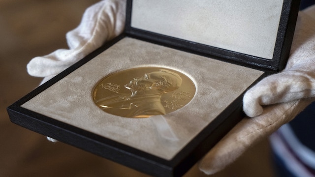 FILE - A Tuesday, Dec. 8, 2020 file photo of a Nobel Prize medal. The Nobel Peace Prize will be awarded on Friday Oct. 8, 2021.(AP Photo/Jacquelyn Martin, File)