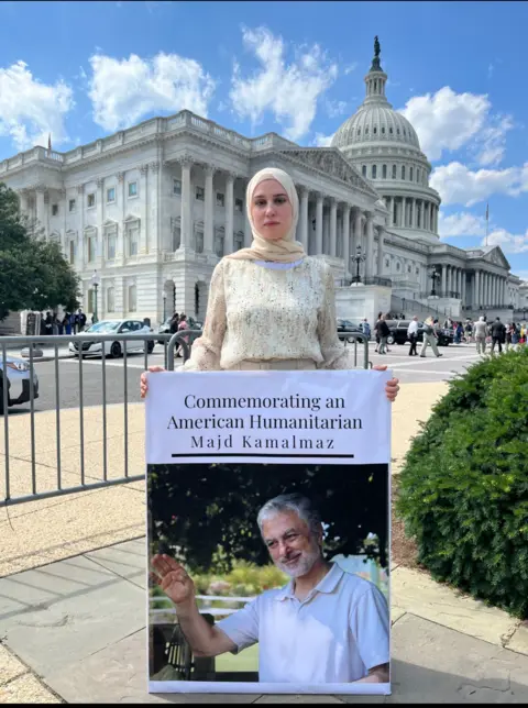 Maryam Kamalmaz Maryam Kamalmaz with a photo of her father 