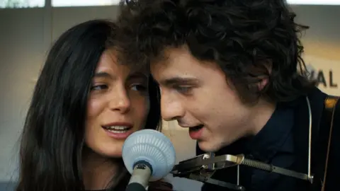 Searchlight Monica Barbaro and Timothee Chalamet in A Complete Unknown