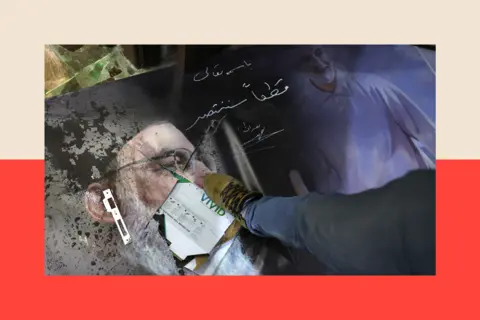 Getty Images A man steps on a damaged portrait of slain Hezbollah leader Hassan Nasrallah and Iran's late general Qassem Soleimani 