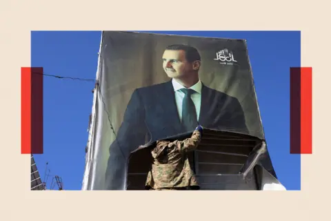 Getty Images An anti-government fighter tears down a portrait of Syria's President Bashar al-Assad in Aleppo