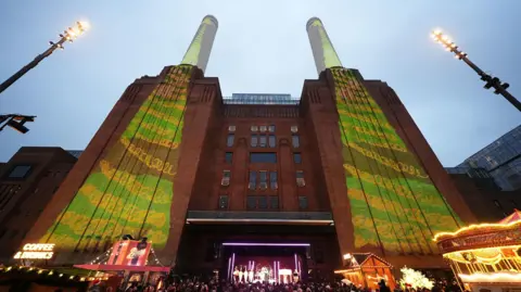 PA Media The singer Raye performed at the end of the King's visit to Battersea Power Station