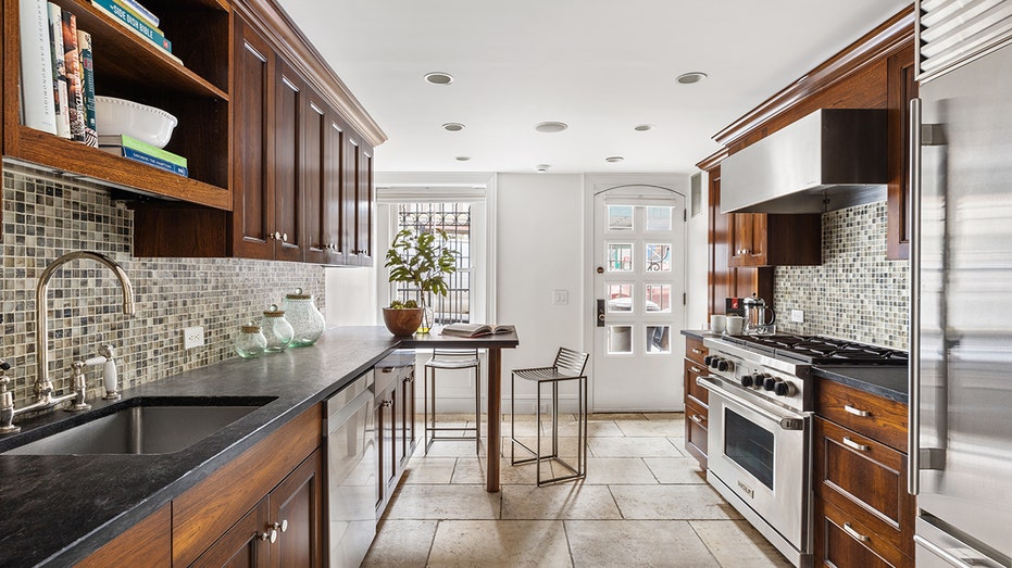 The eat-in kitchen features high-quality appliances and a breakfast bar.