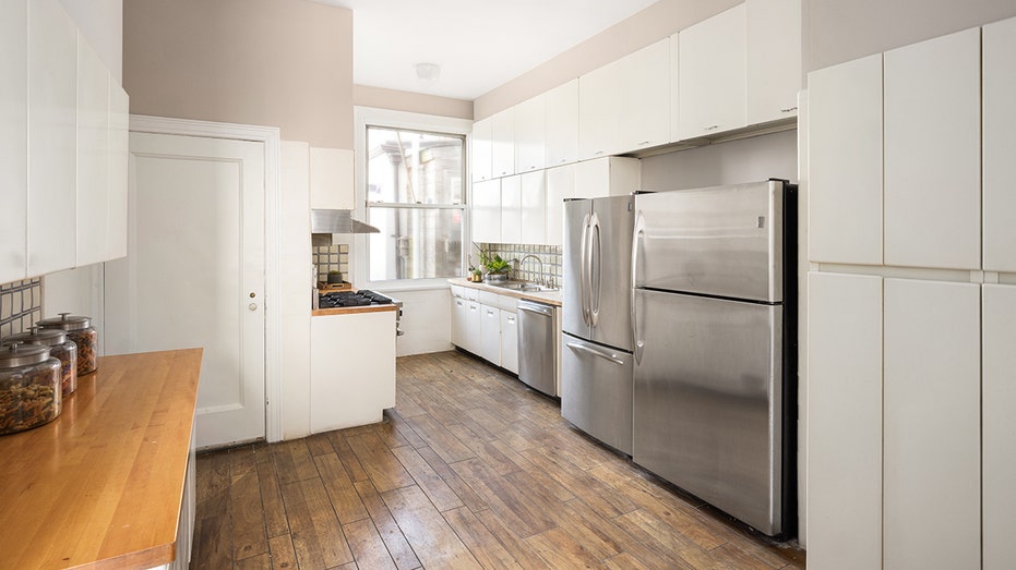 The large kitchen is found behind the dining room.