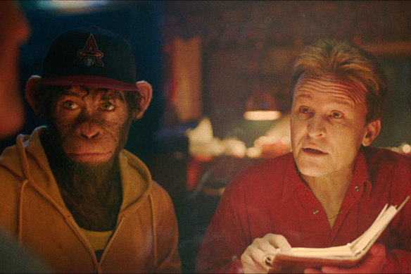 Damon Herriman, who plays Take That’s manager, with Jonno Davies (left), as a monkey version of Robbie Williams, in Better Man.