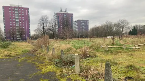 Photograph of empty land in Collyhurst - around ten years after several blocks of maisonettes were demolished around 10 years ago.